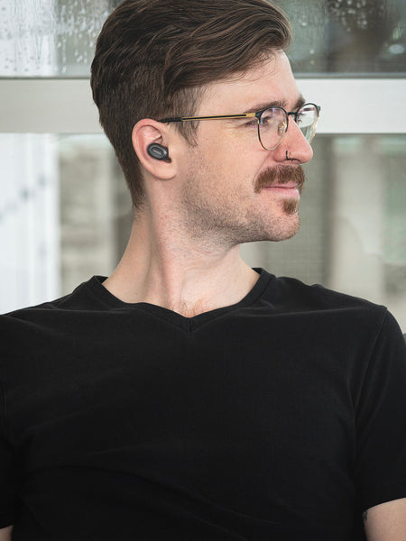 Young man wearing Koss TWS250i True Wireless Ear Buds 